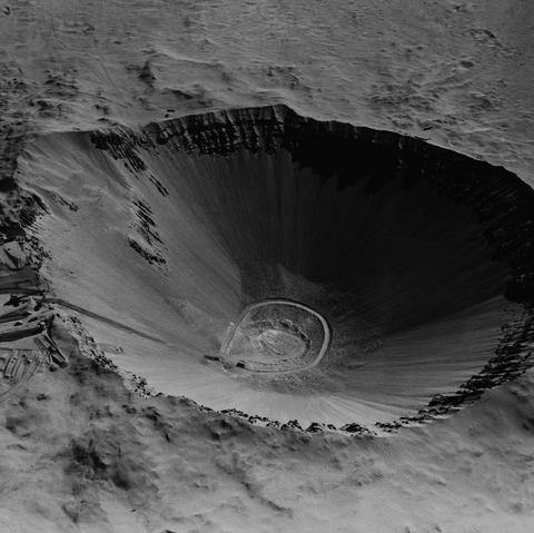 A crater left behind after a 100-kiloton thermonuclear bomb test at the Atomic Energy Commission’s Nevada Test Site in July 1962.