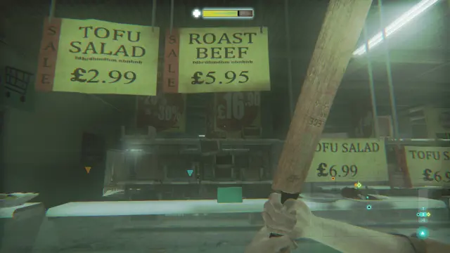 Screenshot aus dem Spiel Zombi mit verschiedenen Preistafeln. Zu sehen sind Tofu Salad für 2,99 Pfund, Roast Beef für 5,95 Pfund, Noch mehr Tofu Salad für 6,99 Pfund. Darüber hinaus steht noch Kauderwelsch auf den Tafeln.