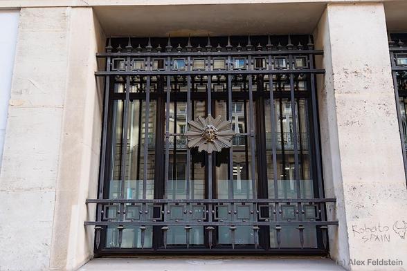 Window in Paris with bars on it
