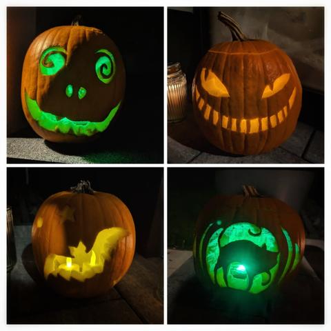A captivating collage of four intricately carved pumpkins, each illuminated to create a spooky Halloween display. The top-left pumpkin features a whimsical face with swirling eyes and a cheeky smile, glowing with an eerie green light. The top-right pumpkin showcases a classic jack-o’-lantern design with sharp, jagged teeth and menacing eyes, lit by a warm orange candlelight. The bottom-left pumpkin is carved with a bat flying across a crescent moon, illuminated by a soft yellow light. The bottom-right pumpkin displays a cat silhouette, enhanced by a green internal light. The pumpkins are set against a dark background, adding to the festive and mysterious Halloween ambiance.