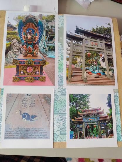 Four photos on a scrapbook: first a colourful statue of Garuda, then top right a Chinese style archway, bottom left is a photo of a Chinese zodiac bronze display (year of the rat, a Chinese style rat drawing is in black), and at the bottom right a colourful Chinese archway with hanging lanterns.