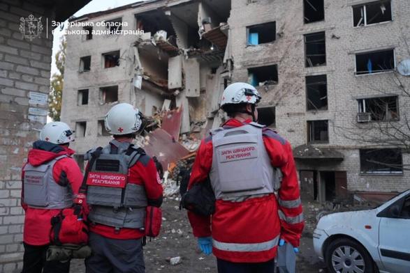 Emergency workers outside a residential building struck overnight on Oct. 30, 2025, during a mass Russian missile and drone attack on Ukraine. (State Emergency Service of Ukraine)
