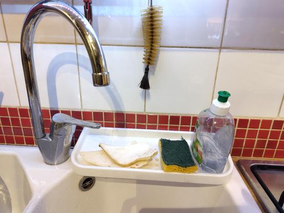 Photo of the soap dish assembled and in place on my sink. It fit perfectly !