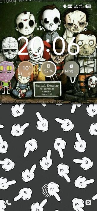 Captura de pantalla de bloqueo de smartphone con varios personajes del cine de terror en dibujos animados y manos de Mickey enseñando el dedo corazón.