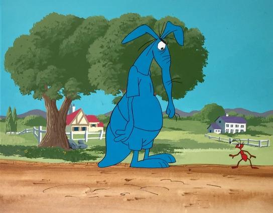 A still from the animated series "The Ant and the Aardvark" from "The Pink Panther Show".

Against a background of green hills with fenced houses and trees, standing on a brown dirt road are a blue aardvark in identically coloured blue shirt and shorts looking down at a red-brown anthropomorphic ant standing in a pose indicating that it is about to flee.