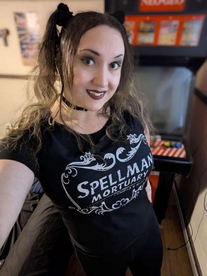 Me in front of my Neo Geo MVS Cabinet wearing a "Spellman Mortuary" shirt from the Sabrina TV show
