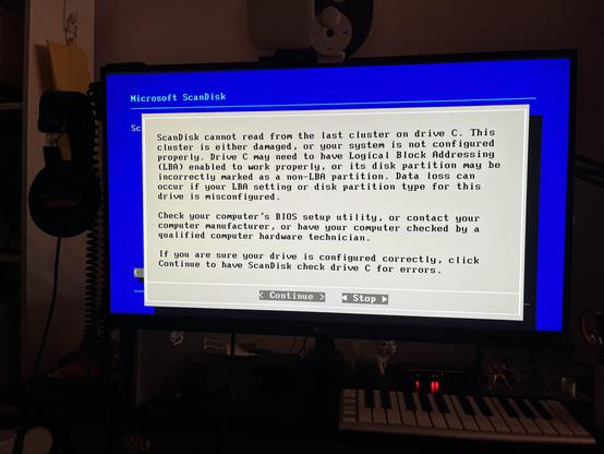 Microsoft ScanDisk

ScanDisk cannot read from the last cluster on drive C. This
cluster is either damaged, or your system is not configured
properly. Drive C may need to have Logical Block Addressing
(LBA) enabled to work properly, or its disk partition may be
incorrectly marked as a non-LBA partition. Data loss can
occur if your LBA setting or disk partition type for this
drive is misconfigured.
Check your computer's BIOS setup utility, or contact your
computer manufacturer, or have your computer checked by a
qualified computer hardware technician.
If you are sure your drive is configured correctly, click
Continue to have ScanDisk check drive C for errors.
Continue
Stop