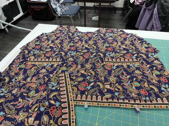 A vivid aubergine batik is cut into a bodice for a top, with pockets attached.