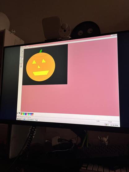 MS Paint. Crude drawing of carved pumpkin.