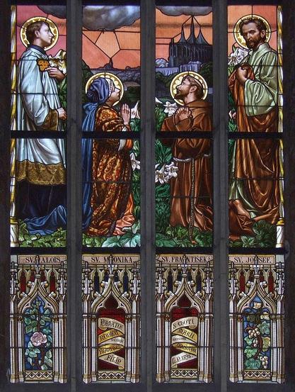 Detail of a stained glass window in St. Barbara's Church (Kutná Hora, Czech Republic). The window depicts St. Aloysius, St. Monica, St. Francis of Assisi, and St. Joseph in prayer. Today is All Saints' Day.