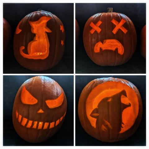 A collage of four intricately carved pumpkins, each illuminated from within by a warm, glowing light. The top-left pumpkin features a silhouette of a cat wearing a witch’s hat, accompanied by a crescent moon and two stars. The top-right pumpkin depicts a sad face with crossed-out eyes and a frowning mouth. The bottom-left pumpkin showcases a classic, exaggerated evil face with jagged eyes, a crooked nose, and a toothy grin. The bottom-right pumpkin displays the silhouette of a howling wolf’s head. The pumpkins are set against a dark background, creating a striking and festive Halloween atmosphere.