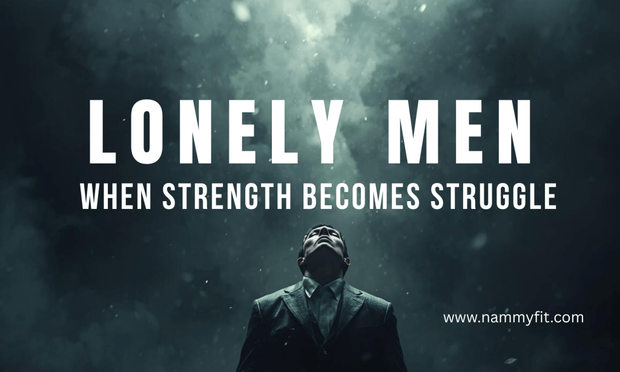 A solitary man sits on the edge of a bed in a dimly lit room, his posture heavy with exhaustion and thought. The light from a window falls softly on his face, symbolizing loneliness, vulnerability, and the quiet emotional burden men carry in a world that expects them to be strong and unshaken.