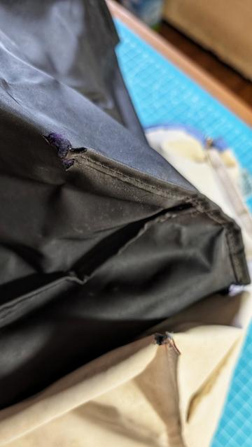 Two Longchamp bags turned inside out, one with black lining, the other off-white.