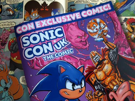 Photo of the front cover of Sonic Con UK The Comic, captioned Con-exclusive Comic, featuring Sonic, Robotnik, Brutus, and Tails