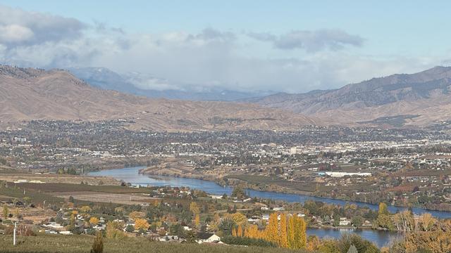 Yet another photograph from my deck on an absolutely gorgeous day. Early morning sunlight bringing out the blues of the Columbia river and the yellows of the autumn foliage on some trees. The sky is blue with some white clouds and, in the far distance, there's snow on the few North Cascade peaks in sight.

This photo copyright 2025 by Maria Langer. All rights reserved. Neither this image nor the accompanying alt text may be used to train AI systems.