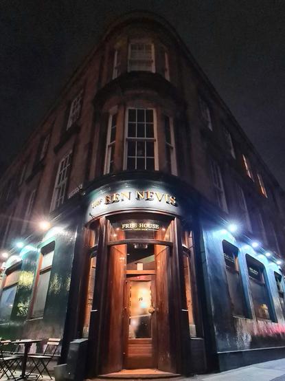A corner pub on the ground floor of a Victorian tenement in the West End of Glasgow.