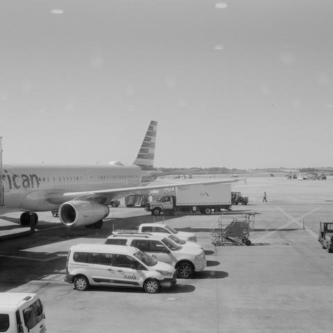 Mamiya 6 IV | Cinestill BWXX 250

Home developed in XTOL Stock | 9:30 @ 22 C | Rotation

Looking out at the tarmac at the airport on our way to New York, plane at the gate and service vehicles surrounding it
