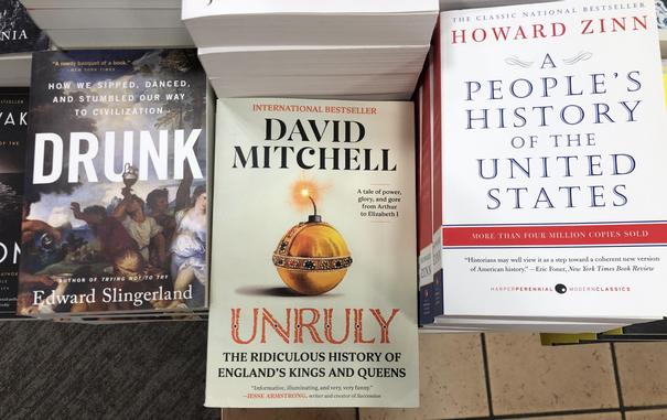 Three books ordered in left to right with the titles “Drunk” and “Unruly” and “A people’s history of the United States”