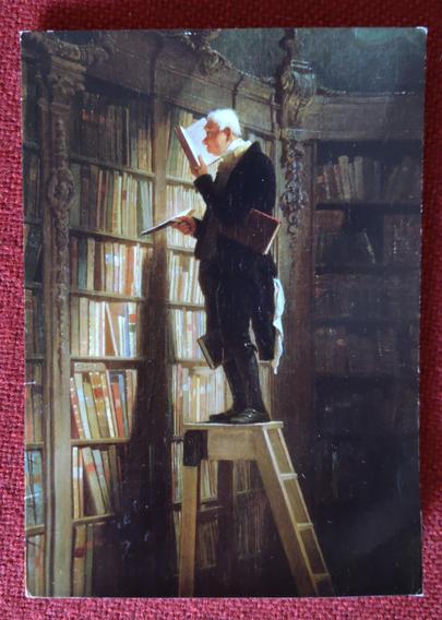 Een buurtbewoner had een kaart achtergelaten. Voorzijde: een schilderij van Carl Spitzweg - De boekenwurm (ca 1850): Een man staat op een trap voor een hoge boekenkast te lezen in een boek.