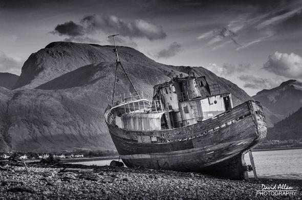 The former fishing boat, originally built in 1975 as the MV 'Dayspring', pictured here, wrecked on the shores of the Scottish Highland's Loch Linnhe, near Fort William. In the background, a cloud-free Ben Nevis plays a dominant role in the composition.