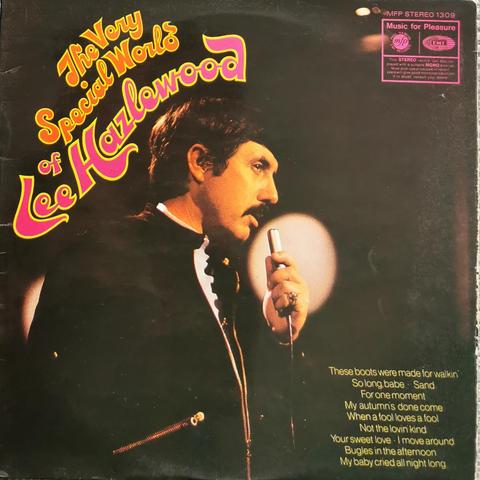 LP cover of The Very Special World Of Lee Hazlewood. Cover shows an upper body side shot of Lee holding a microphone. The background is dark with the odd spotlight.