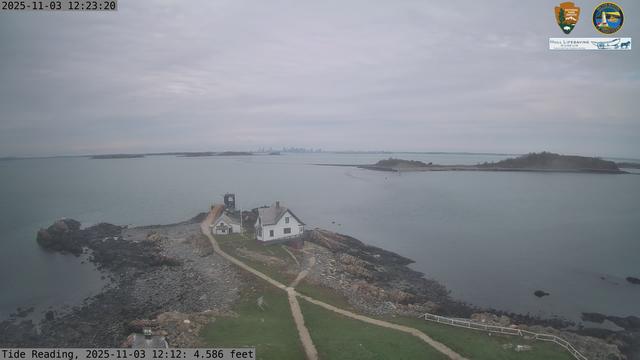 Camera looking west from Boston Light on Little Brewster Island. View looks toward downtown Boston in the distance, with several islands including Great Brewster and Georges Island in the midground.