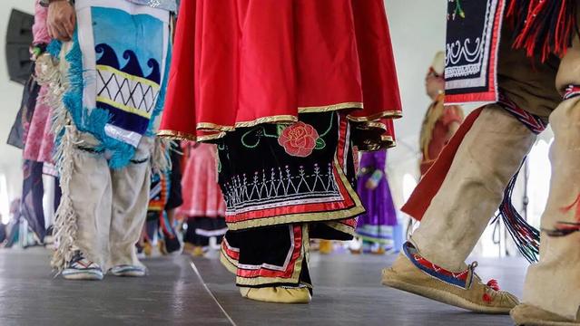 The legs and feet of Haudenosaunee dancer in traditional wear