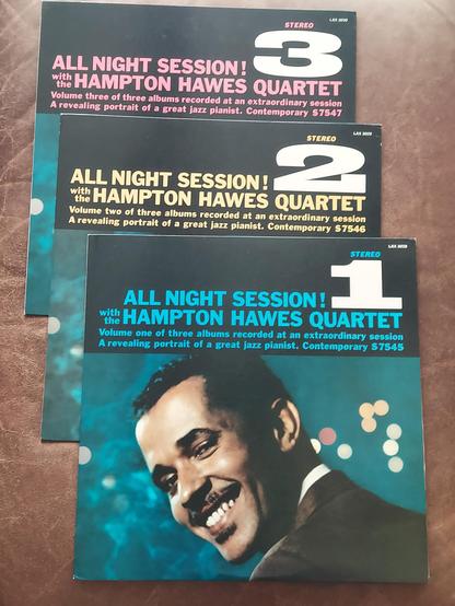 Jackets for three LPs titled "All Night Session" 1, 2, and 3 by the Hampton Hawes Quartet (Hawes on piano, Hall,  Red Mitchell on bass and Bruz Freeman on drums. The image is a color shot of Mr Hawes smiling over his shoulder towards the camera.
