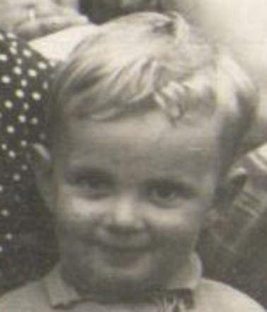 A portrait photo of a smiling young boy