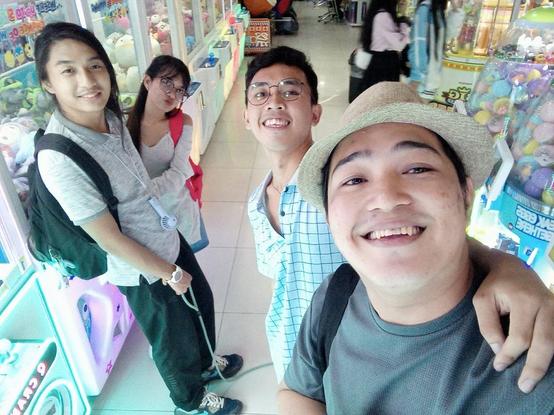 Groupie with my GF, her brother, and his BF at an arcade. I'm holding a leash, Tobii is off screen