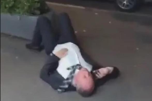 Barnaby Joyce drunk & lying beside the road.