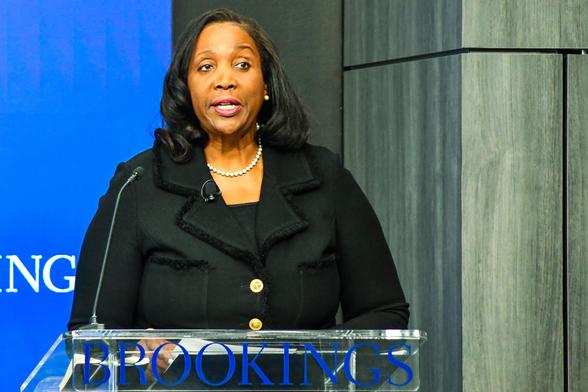 ALT: Federal Reserve governor Lisa Cook behind a lectern speaking at the Brookings Institution, 3 Nov. 2025.