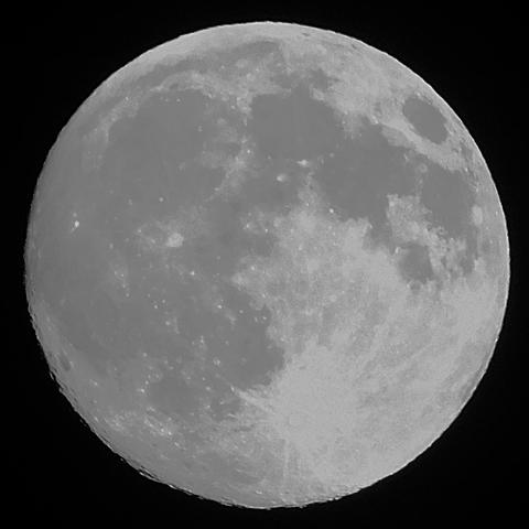 A picture of the full moon, with the blackness of the night sky as background. A lot of detail of the lunar surface is visible in this picture.