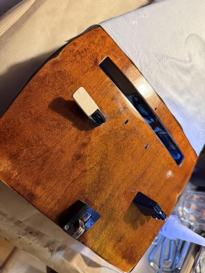 Photo of the top of the body with several black 3D printed pieces mounted.