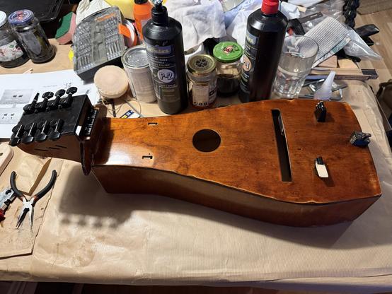 Photo of the entire hurdy gurdy as it looks now with several 3D printed pieces mounted.