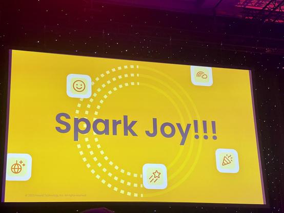 A very yellow presentation slide with the bold purple text “Spark Joy!!!” and a with festive and happy icons and emojis.