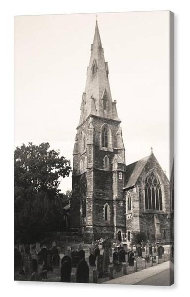 Black and white portrait film photograph of a Victorian church with a tall steeple.  The image is shown printed upon a box canvas.