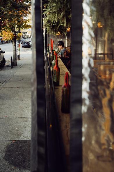 A diner sits on a heated patio amongst autumn colours.