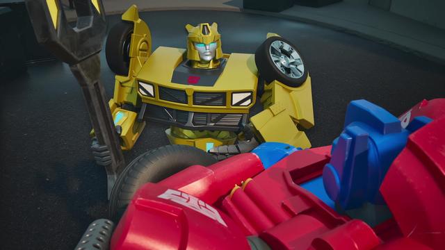 Bumblebee converses with Optimus Prime, brandishing an oversized wrench in Transformers: CYBERWORLD.