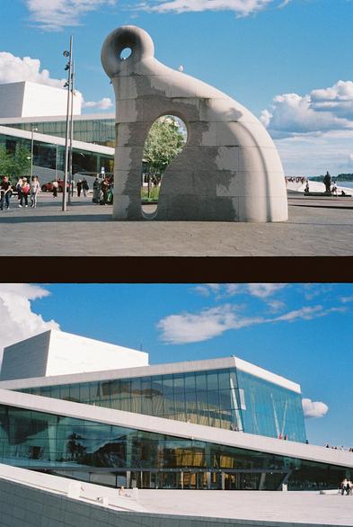 A vertical diptych made up of two horizontal photos of a sunny day in downtown Oslo. The top photo shows a large and abstract stone sculpture in an open space outside the library, with the opera building in the background. People are walking by, sightseeing and enjoying the weather. The bottom photo shows the Oslo Opera House with its glass walls and snow-white, walkable roof against a bright blue sky with puffy, white clouds.