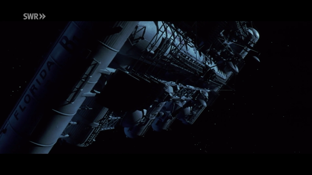 the FLORIDA ARKLAB experimental US/EU space station is shown from the outside. it consists of multiple tubes arranged in a square order. it looks somehow familiar and very similar to nowadays ISS, but completely lacks any solar energy creation system.