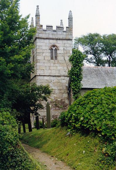 A modest medieval, gothic church built of grey granite blocks.
