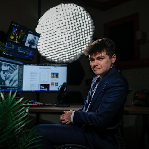 Nick Fuentes in his home studio in Berwyn, Ill.