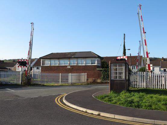 Exterior view of Pembrey Signal Box with adjacent level crossing in Burry Port.