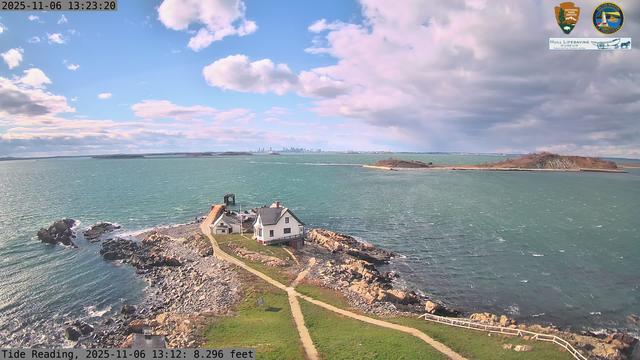 Camera looking west from Boston Light on Little Brewster Island. View looks toward downtown Boston in the distance, with several islands including Great Brewster and Georges Island in the midground.
