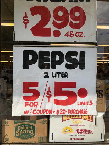 Hand-painted sign reading "Pepsi 2 Liter 5 for $5.00. Limit 5. W/ Coupon + $20 Purchase"
