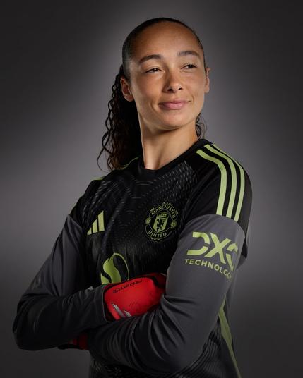 Phallon Tullis-Joyce poses in our 2025/26 goalkeeper shirt.