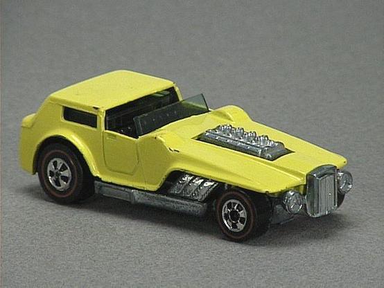 Released in 1973, Dark Green Hiway Robber of 1973 Hot Wheels with Redline wheels. Packaging: 1973 Blister. Metal Body, Metal Base. Made in Hong Kong. Scarcity: 8/10