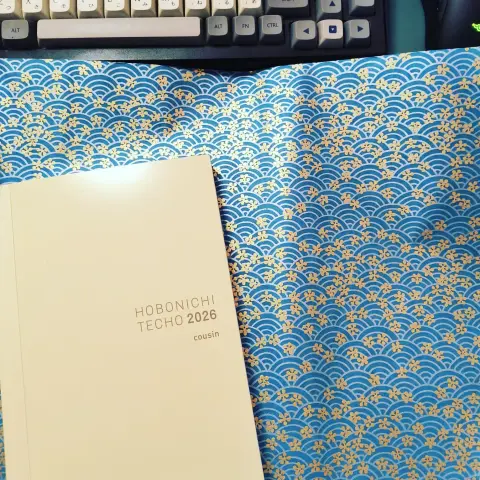 Handmade paper with classic blue seigha pattern featuring gold cherry blossoms and a brand new 2026 Hobonichi Techo Cousin (A5), Japanese edition
