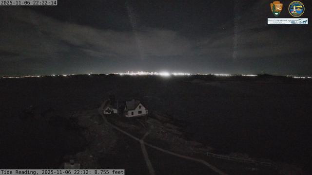 Camera looking west from Boston Light on Little Brewster Island. View looks toward downtown Boston in the distance, with several islands including Great Brewster and Georges Island in the midground.